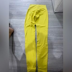 Yellow. Never worn. Size 4. High rise 26”